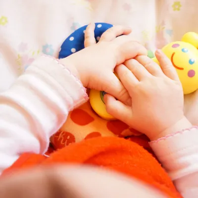 Baby holding a toy