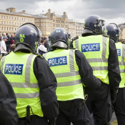 Photograph of police in riot gear