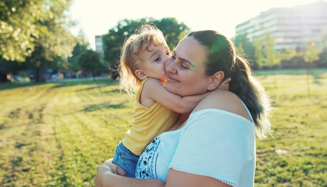 Woman holding a young child