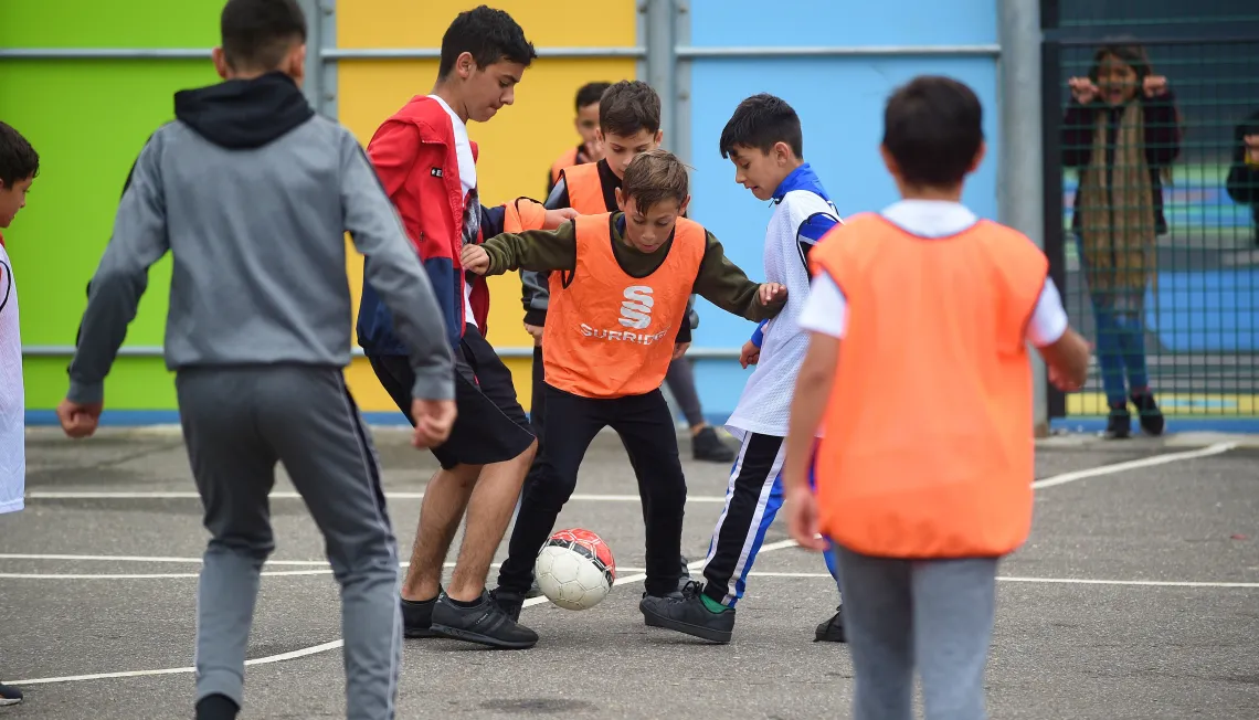 Children taking part in a football game run by Suffolk Positive Futures.