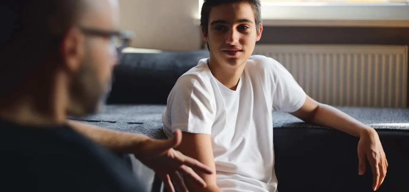 Photograph of a boy walking to a support worker